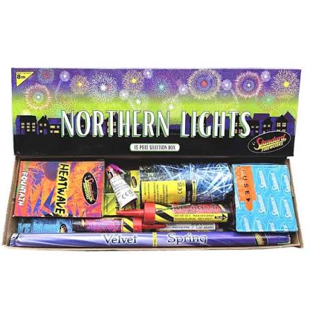 A boxed fireworks selection set labeled 'Northern Lights' with multiple colorful firework tubes and packets arranged inside an open box on a white background.